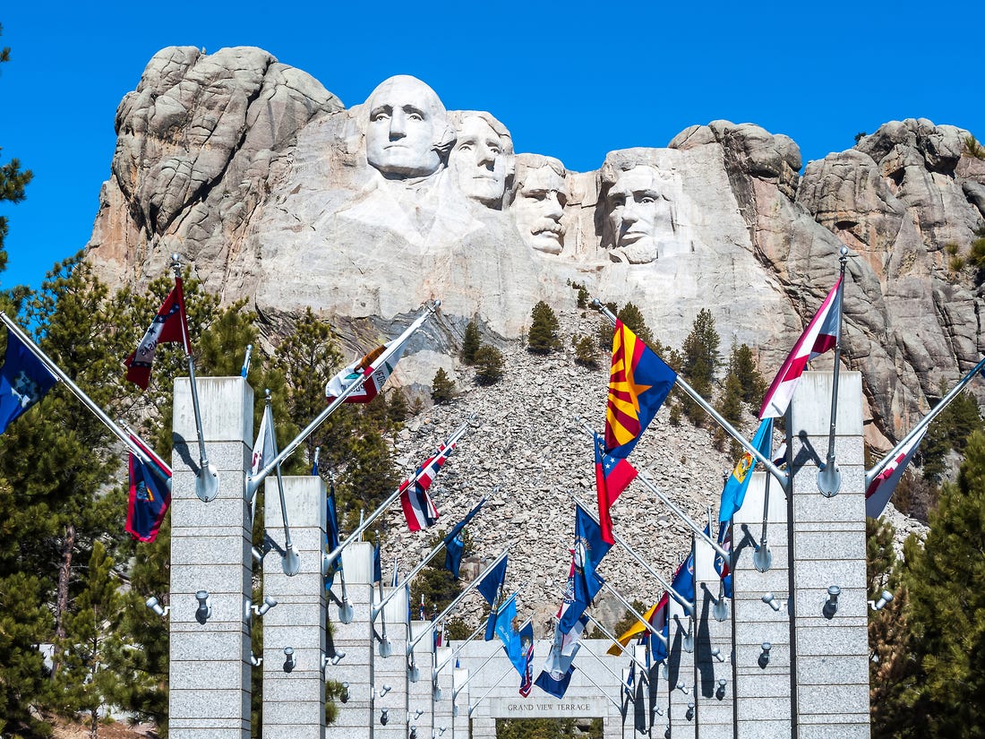 Pathway with 50 flags for reaching Mount Rushmore