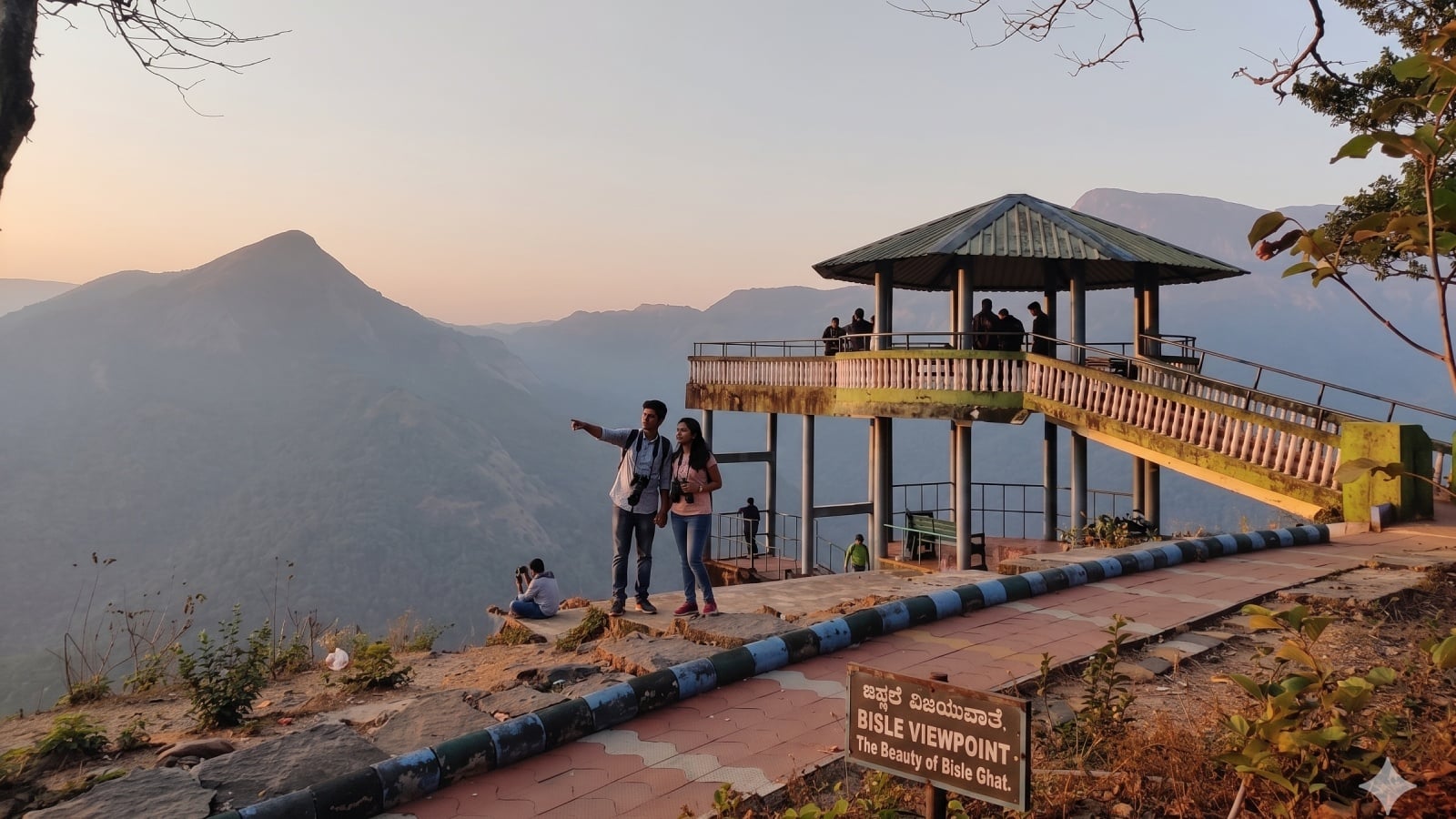 Tourists enyoing the sunset at Bisle Ghat View Point, Sakleshpur