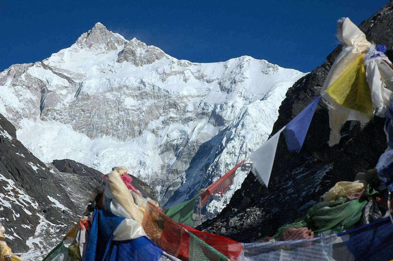 Prayer flags at Goecha La with Kangchenjunga behind