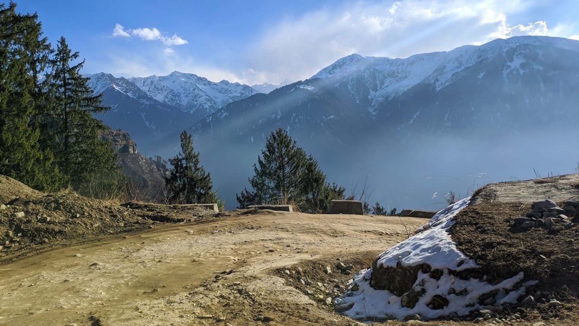 Trekkers crossing the Hampta Pass in Himachal Pradesh with snow patches