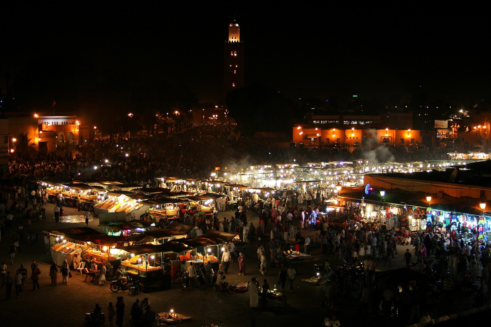 Jemaa el-Fnaa square in Marrakesh at night with lit food stalls