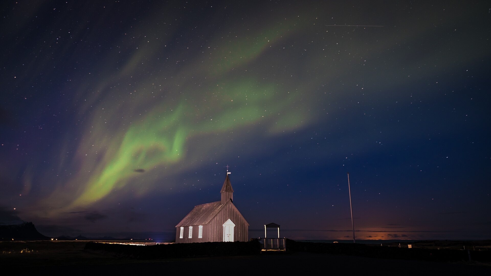 Northern Lights above the black church at Budir, Iceland