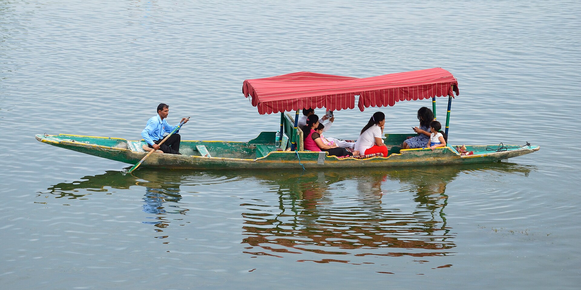 Shikara boat on Sukhna Lake Chandigarh with the Shivalik hills behind