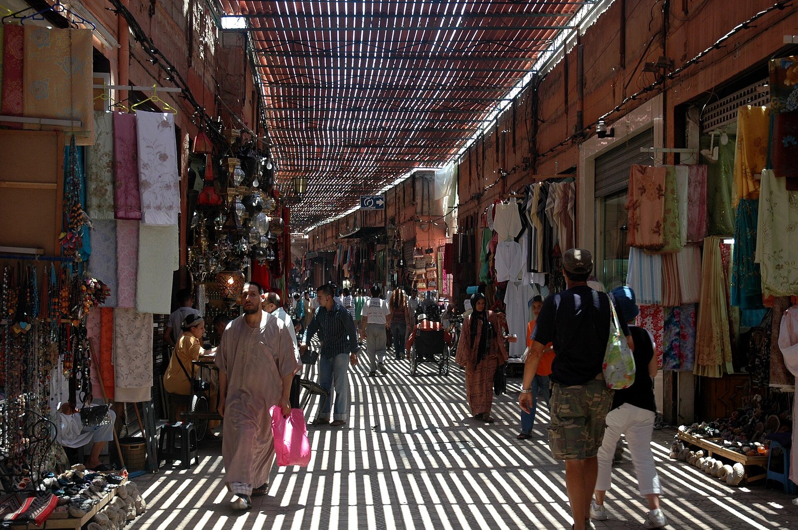 Covered Souk Semmarine in the Marrakesh medina with shoppers under slatted roof