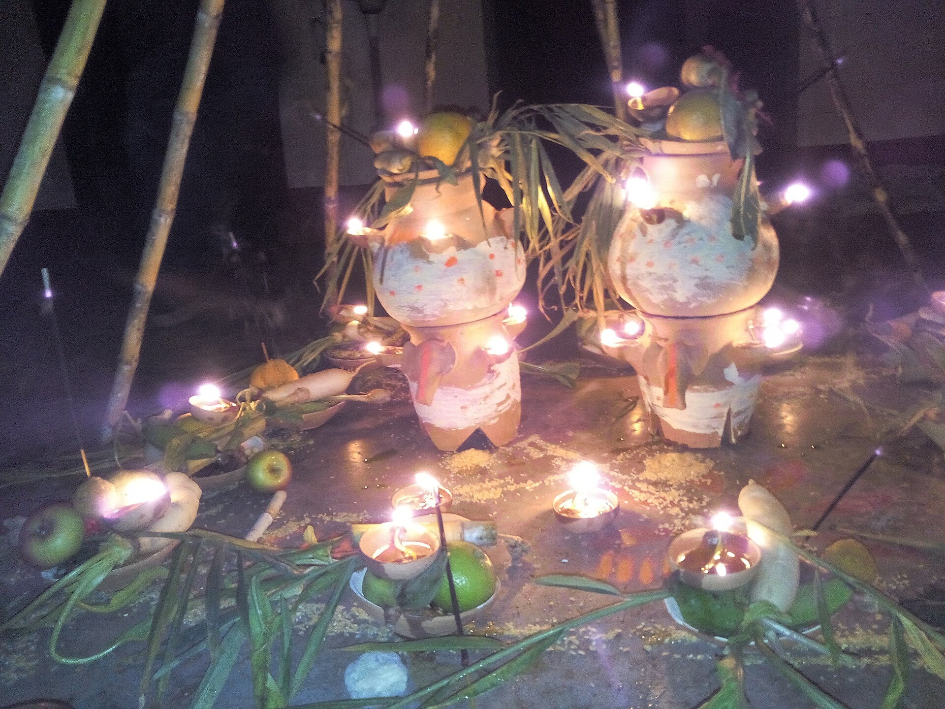 Kosi ritual at night during Chhath Puja with sugarcane canopy, earthen pots and diyas in West Champaran, Bihar