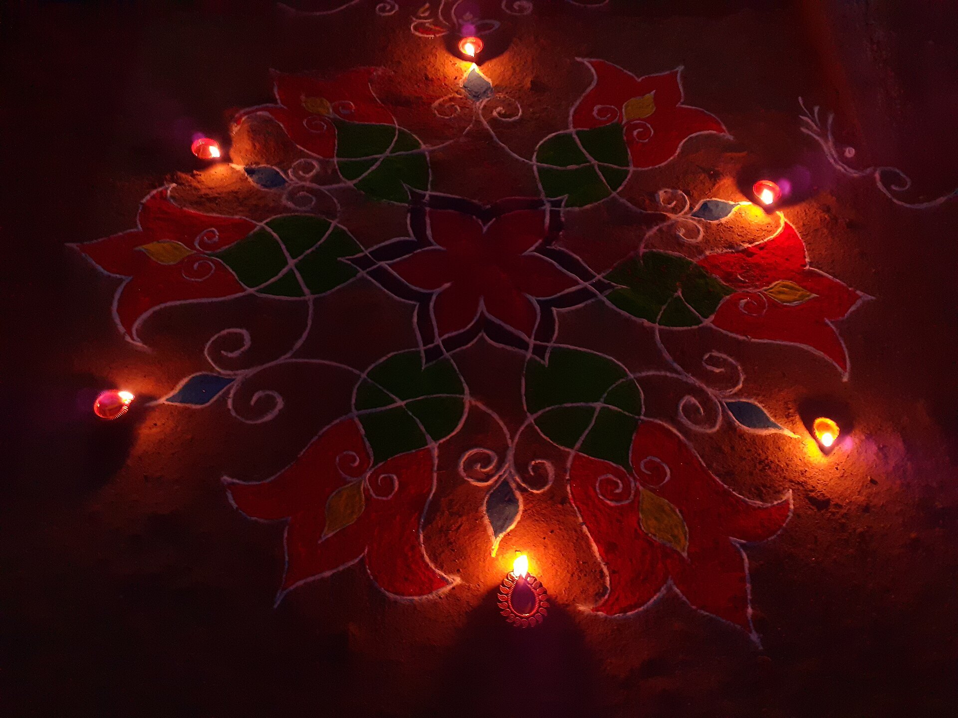 Diwali around the world starts the same way everywhere: a rangoli lit by clay diyas