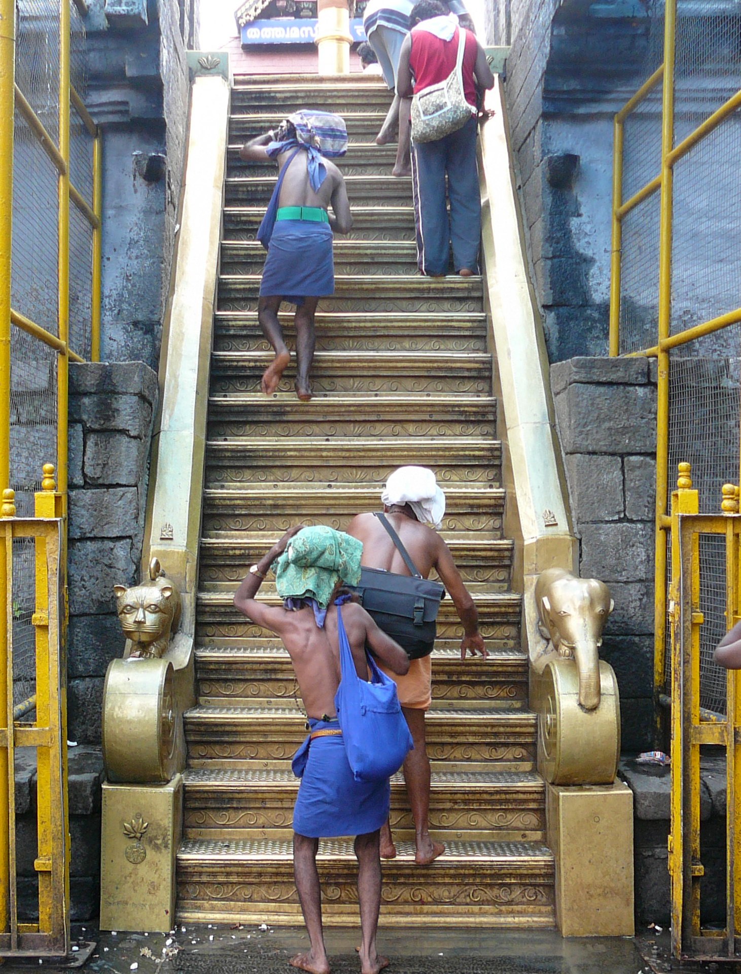 Pilgrims with irumudi on their heads climbing the Pathinettampadi, the 18 holy steps at Sabarimala